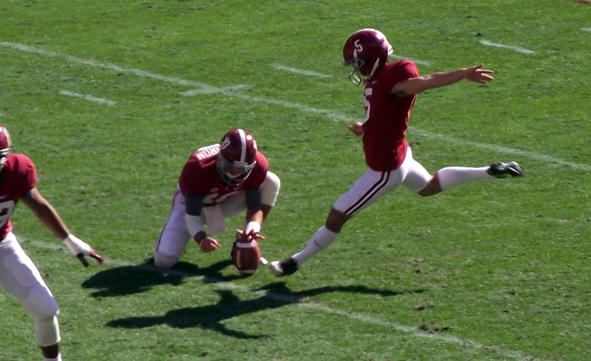 Both the holder and kicker are concentrated on the ball and become vulnerable for injury Both the holder and kicker are concentrated on the ball and become vulnerable for injury